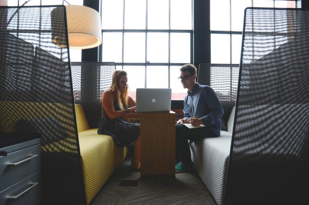 Two employees reviewing benefits